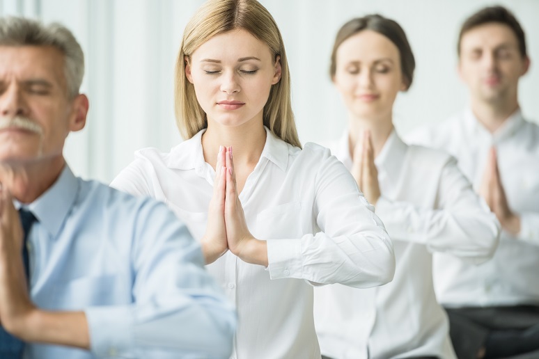 Photo of workers getting all zen in the office